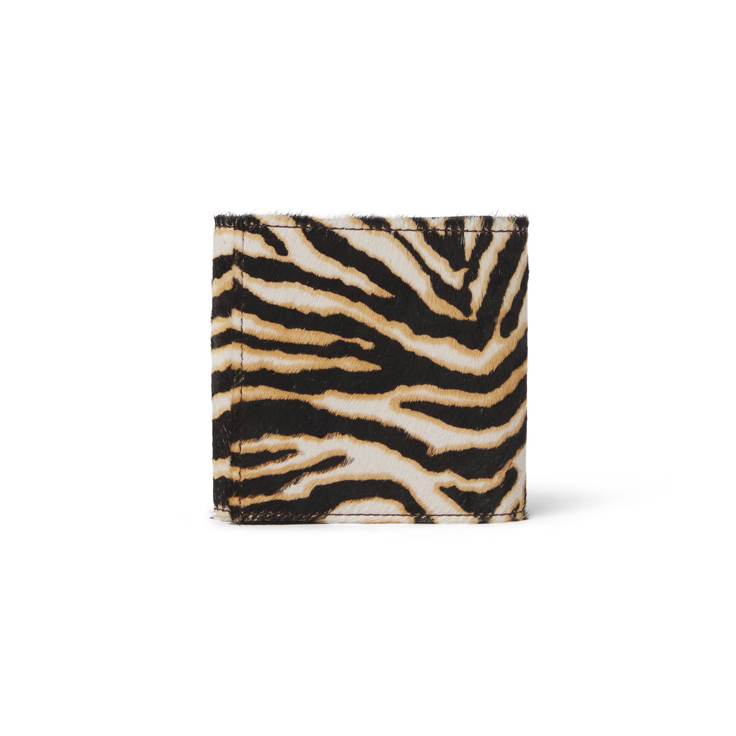 Accesorio artesanal en piel con estampado cebra, pieza exclusiva de lujo hecha a mano en España.