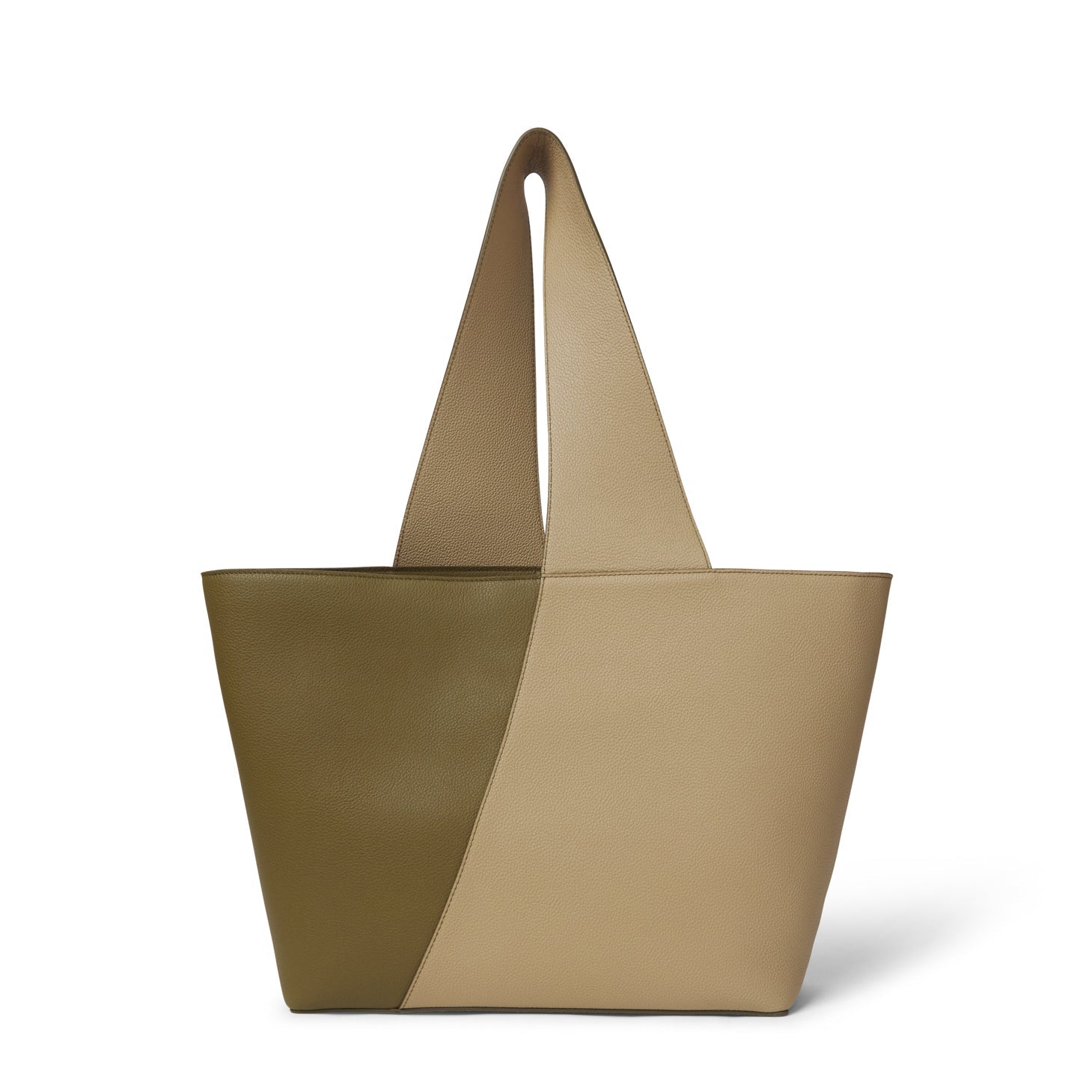 Bolso artesanal de piel vacuna, hecho en España. Diseño estructurado, amplio y elegante, con asa reversible y cierre magnético interior.