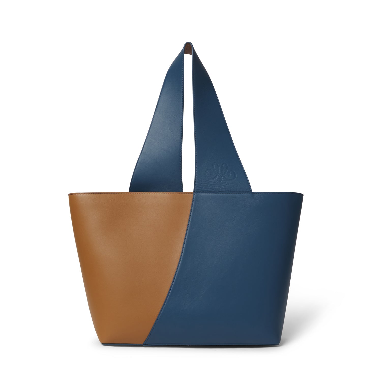 Bolso grande de piel vacuna Made in Spain. Diseño estructurado, gran capacidad, asa reversible y solapas magnéticas para un estilo elegante y práctico.